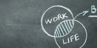 Tafel auf der die Aufschrift "Work Life Balance" steht